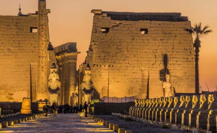 Massive columns of the Karnak Temple in Luxor, Egypt, with intricate hieroglyphics