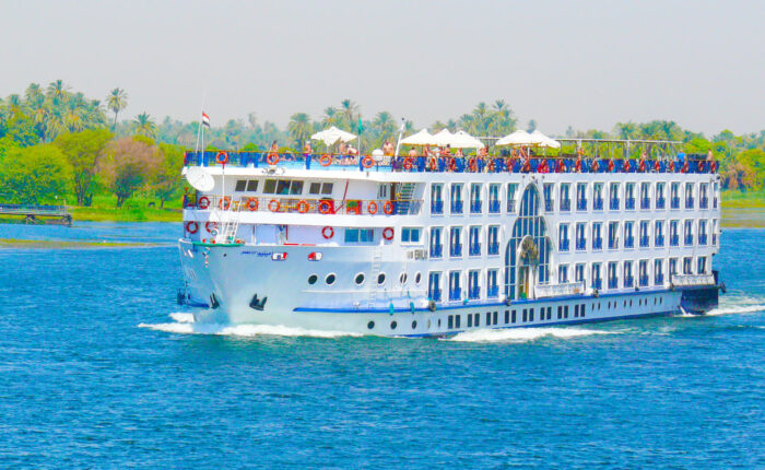 Dinner cruise on the Nile River with live music and entertainment under the night sky in Egypt.